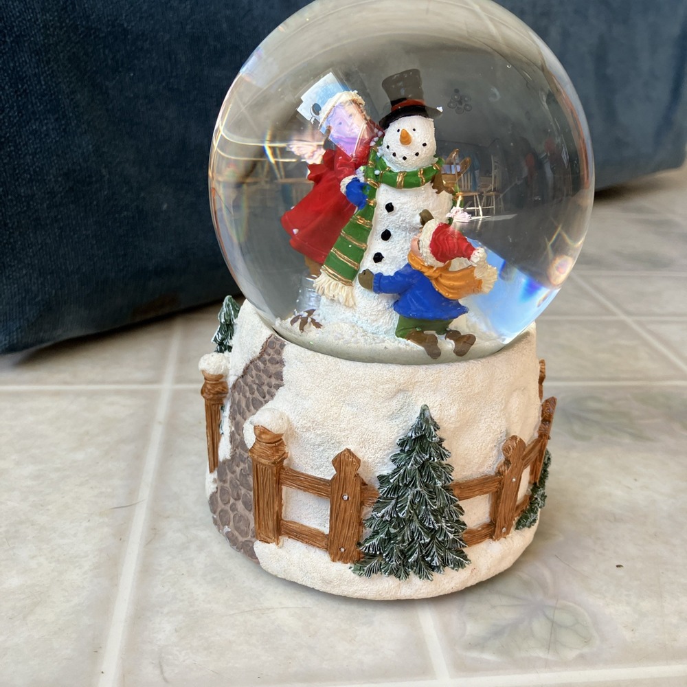 Children Building Snowmen Water Snow Globe plays We Wish You A Merry Christmas